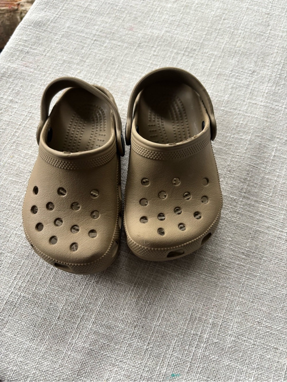 Crocs clogs in tan. Size C6/7